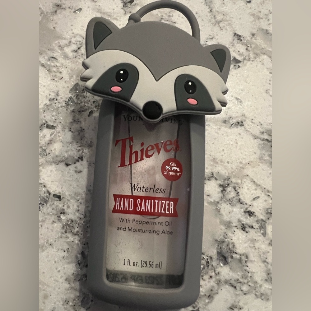 Young Living Thieves Waterless Hand Sanitizer With Gray Raccoon Holder - Picture 2 of 4